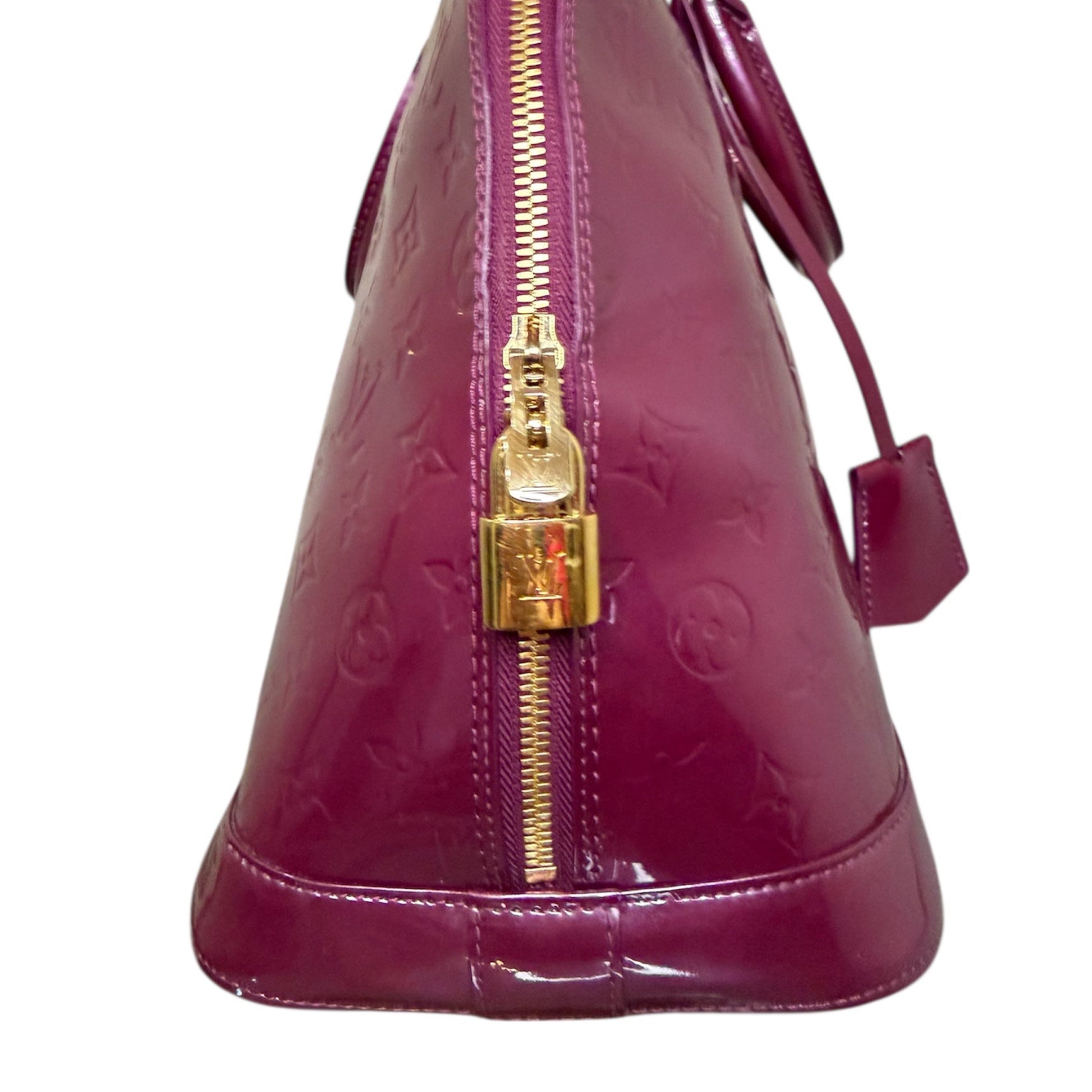 Louis Vuitton Alma MM in Vernis Amethyst from the Trunks & Bags collection, side view.