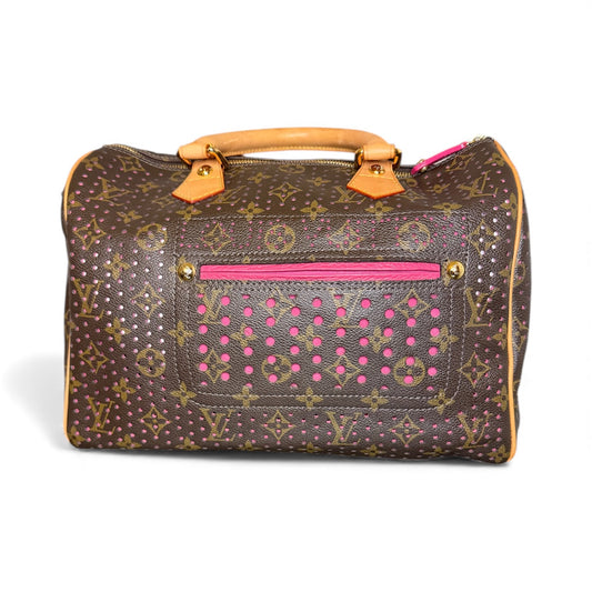 Louis Vuitton Speedy 30 in Monogram Perforated canvas with fuchsia underlay, front view.